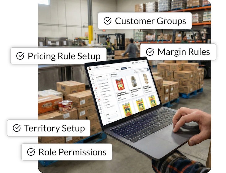 Person using a laptop in a warehouse with inventory management settings displayed